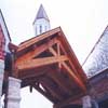 Timber trusses in a row form a breezeway